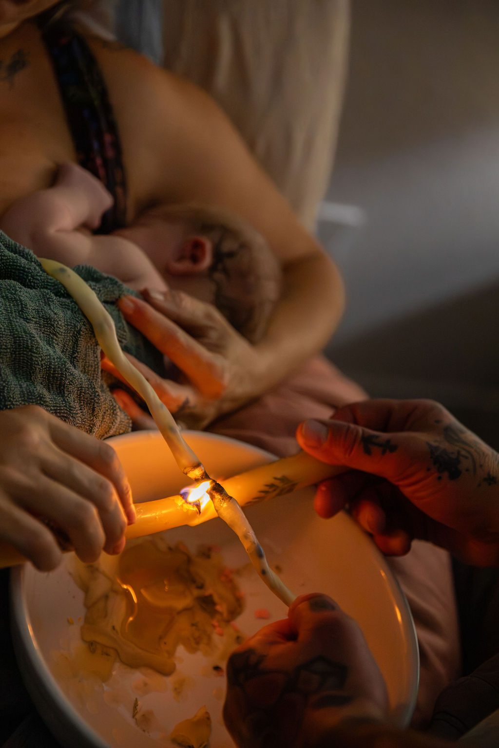 Home birth photography in Las Vegas — candlelit cord burning ceremony