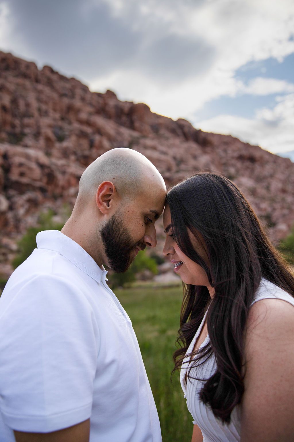 Engagement photography at Red Rock Canyon, Las Vegas — couple resting foreheads together