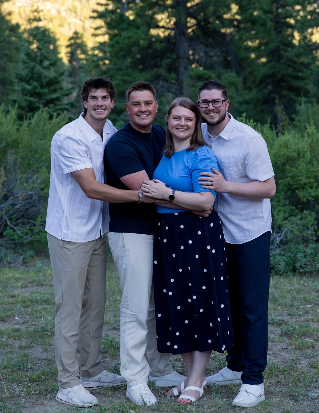 Family photography near Las Vegas — parents and grown sons at golden hour in Mount Charleston